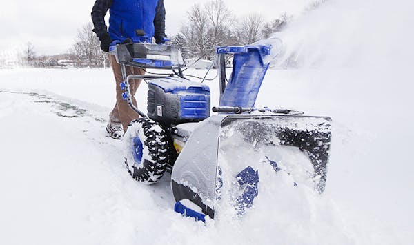 Side view of the Snow Joe 100-volt 24-inch iONPRO Cordless Dual-Stage Snow Blower.