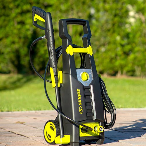 Sun Joe 13-amp 2080 PSI Electric Pressure Washer outside on paving stones.