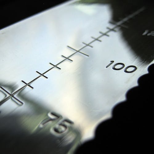 Close-up of the serrations and inch markings on the blade of the Nisaku Yamagatana 7.5-inch Japanese Stainless Steel Knife.