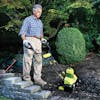 Sun Joe 9-amp 18-inch Electric Tiller and Cultivator being used to till soil.