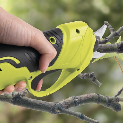 Person snipping a branch with the Sun Joe Cordless Handheld Pruning Shears.