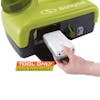 Person inserting a 2.0-Ah lithium-ion battery into the Sun Joe 24-volt cordless portable shower spray washer. Tool only.