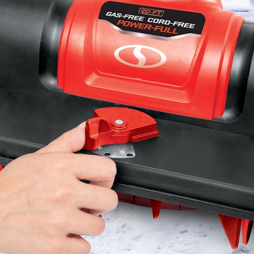 Person adjusting the angle on the Snow Joe 24-volt cordless 12-inch snow shovel kit in red.