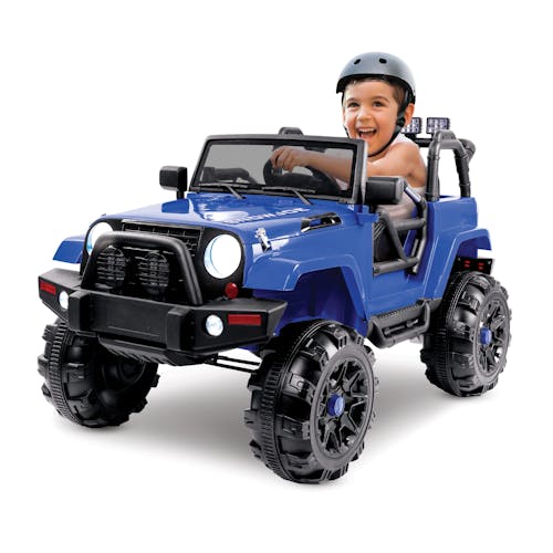 Child wearing a helmet driving the Snow Joe 24-Volt Ride On Kids Truck.