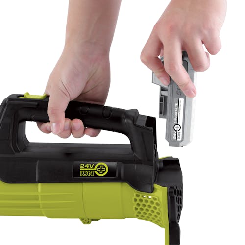 Person putting the battery onto the back of the Sun Joe 24-Volt Cordless Leaf Blower.