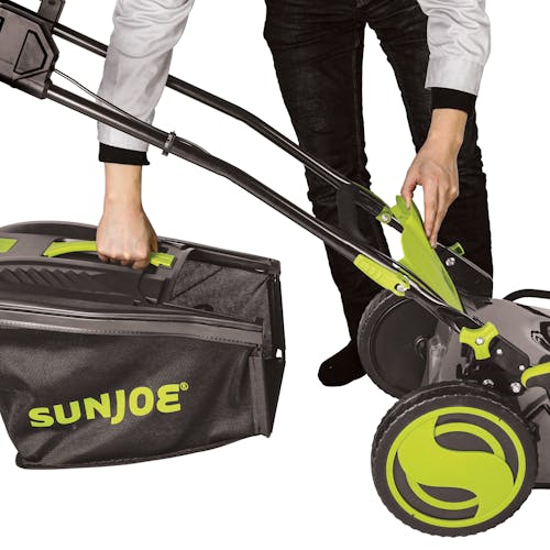 Person attaching the collection bag to the Sun Joe 48-volt cordless 21-inch lawn mower kit.