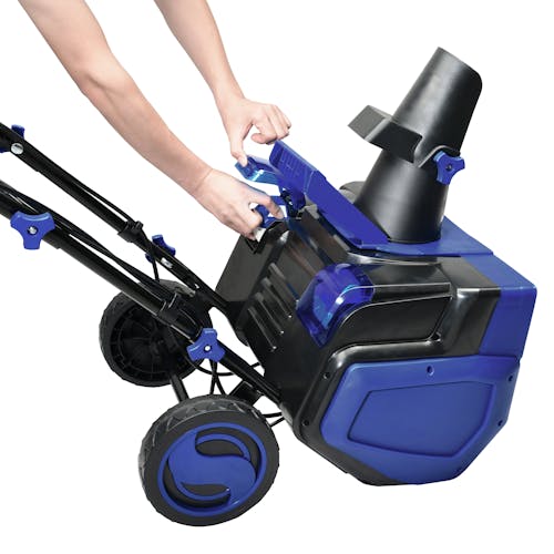 Person inserting a 4.0-Ah lithium-ion battery into the Snow Joe 48-volt cordless 21-inch snow blower kit.