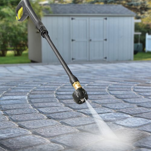 Spray wand for the Sun Joe 48-volt Cordless Portable Pressure Washer Kit being used to wash a driveway.