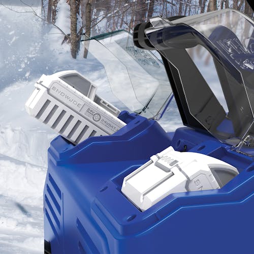 Close-up of the battery compartment for the Snow Joe 48-volt cordless 22-inch single-stage snow blower kit with two 8.0-Ah lithium-ion batteries inside.
