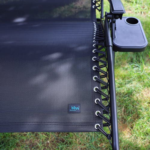 Close-up of the bungees and logo on the 45-inch 2-Person Black Gravity Free Recliner.