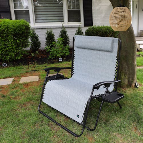 45-inch 2-Person Geometric Grey Gravity Free Recliner under a tree.