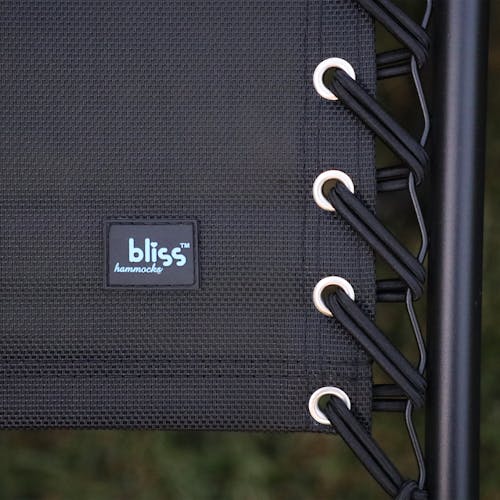 Close-up of the bungees and Bliss Hammocks logo on the 26-inch black gravity free chair.