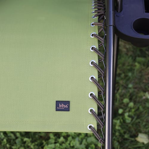 Close-up of the bungees and Bliss Hammocks logo on the 26-inch sage green gravity free chair.