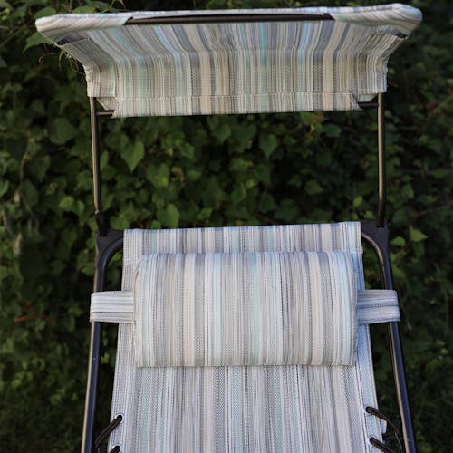 Close-up of the headrest and canopy on the 26-inch casual stripe gravity free chair.