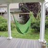Bliss Hammocks 40-inch Light Green Island Rope Hammock Chair hanging on a front porch.