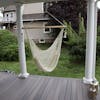 Bliss Hammocks 40-inch White Island Rope Hammock Chair hanging on a front porch.