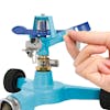 Person adjusting the diffuser pin on the Aqua Joe 6-inch wheeled base Indestructible Zinc Impulse 360 Degree Sprinkler.