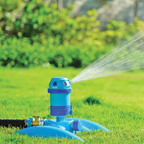 Turbo Drive 360° Sprinkler watering a lawn using the fan spray pattern.