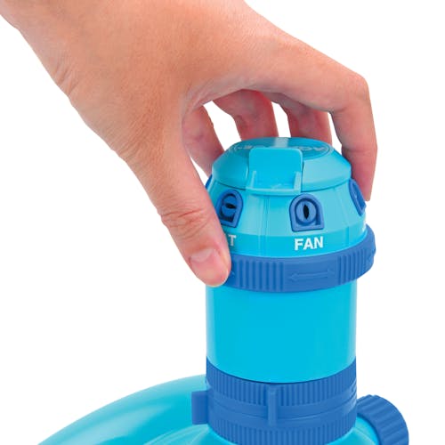 Person adjusting the spray pattern for the Aqua Joe 6-Pattern Turbo Drive 360 Degree Sprinkler.
