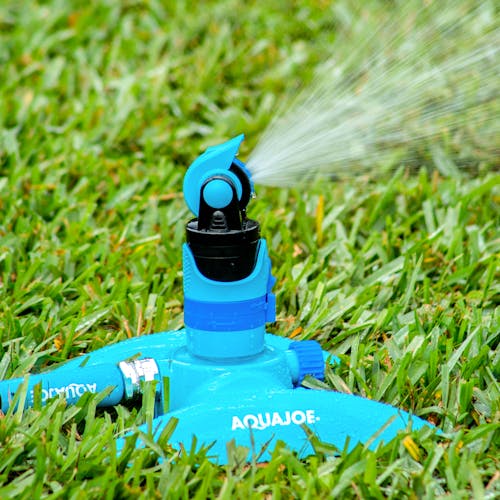 Aqua Joe 4-Pattern Turbo Drive 360 Degree Sprinkler watering a lawn.
