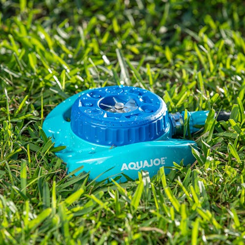 Aqua Joe Indestructible Metal Turret Sprinkler in grass.