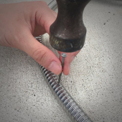 nail failing to puncture aqua joe steel garden hose