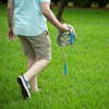 Man carrying Aqua Joe Metal Garden hose