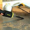 Brush being used with the vacuum to pick up sawdust.