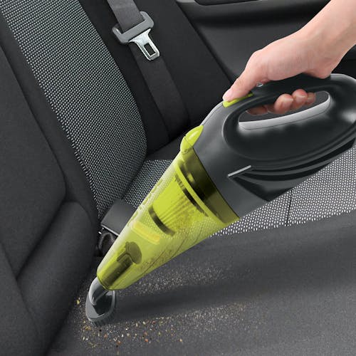 Auto Joe 12-Volt Portable Car Vacuum Cleaner with the brush attachment being used to clean the backseat of a car.