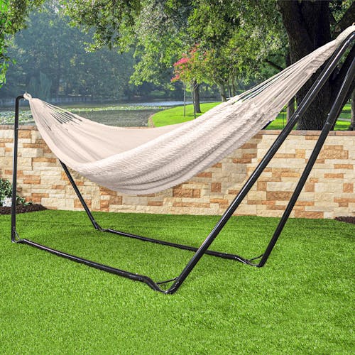Bliss Hammocks 60-inch Wide Traditional Rope Hammock hung on a hammock stand outside.