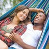 Couple laying in the Bliss Hammocks 60-inch Wide Malibu Double Hammock in a Bag.