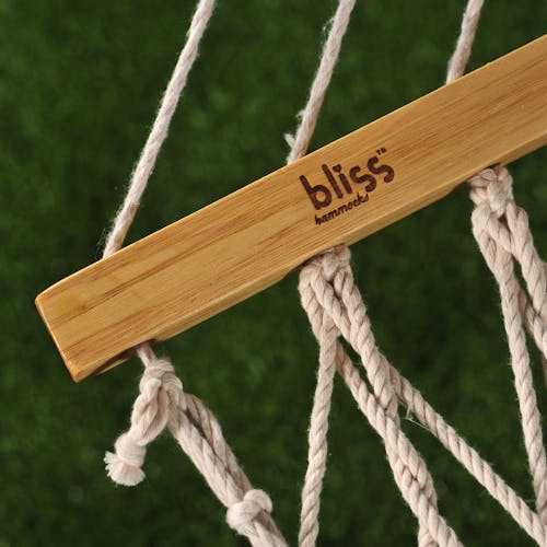 Close-up of the spreader bar with the Bliss Hammocks logo.