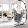 40-inch wide grey hammock chair hanging from a stand in a living room.