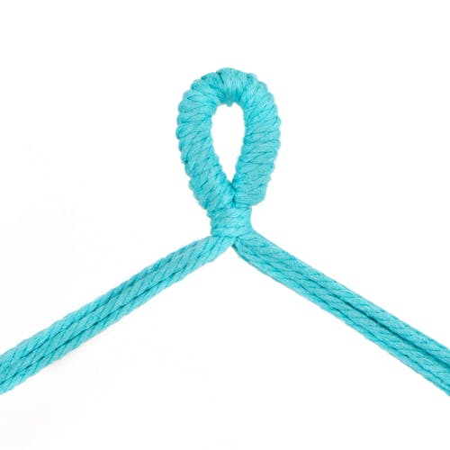 Close-up of the rope loop to hang the Bliss Hammocks 40-inch Wide Light Blue Fringed Hammock Chair.