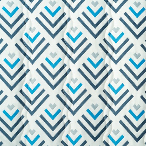 Close-up of the fabric and pattern, showing the white color with a blue, navy, and silver geometric pattern.