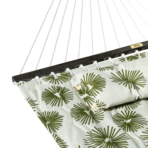 Close-up of the spreader bar on the 55-inch Green Burst Quilted Hammock.