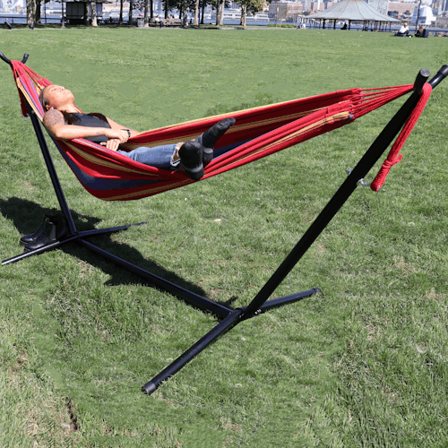 Girl relaxing in the sun on the 60-inch tequila sunrise hammock and stand.
