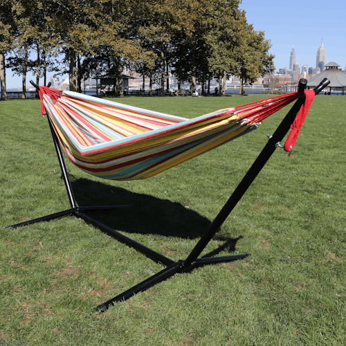 60-inch watermelon stripe hammock and stand at a park.