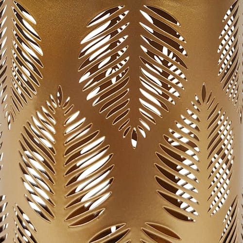 Close-up of the gold hand-painted finish and tropical leaf pattern.