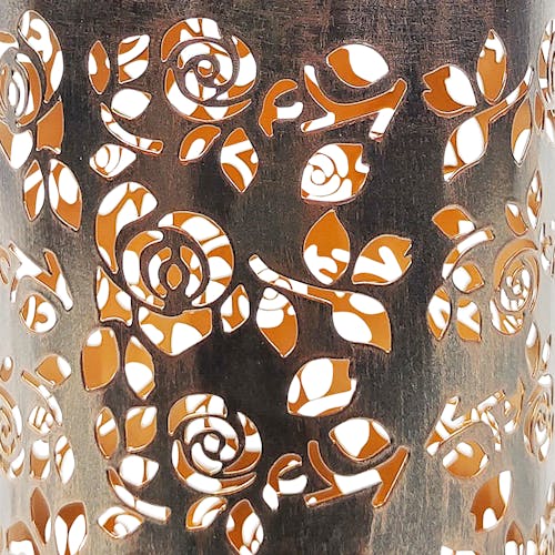 Close-up of the bronze hand-painted finish and rose pattern.