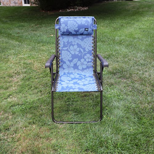 Front view of the 26-inch Blue Flower Reclining Sling Chair on a lawn.