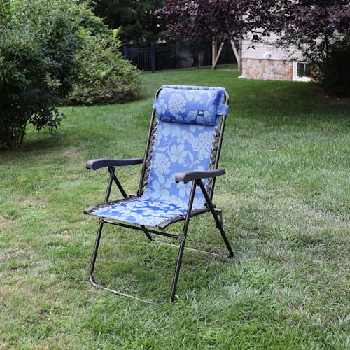 Angled view of the 26-inch Blue Flower Reclining Sling Chair on a lawn.
