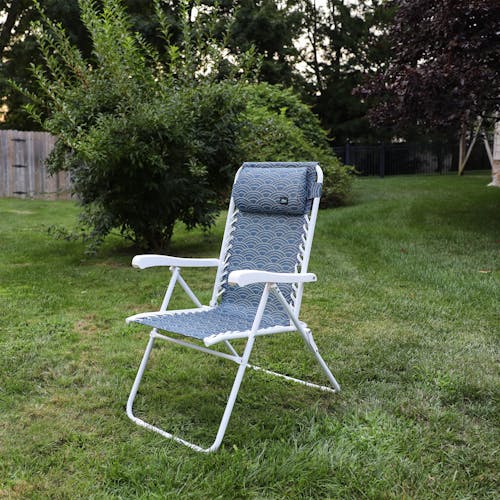 Angled view of the 26-inch Blue Scallop Reclining Sling Chair on a lawn.