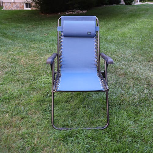 Front view of the 26-inch Denim Blue Reclining Sling Chair on a lawn.