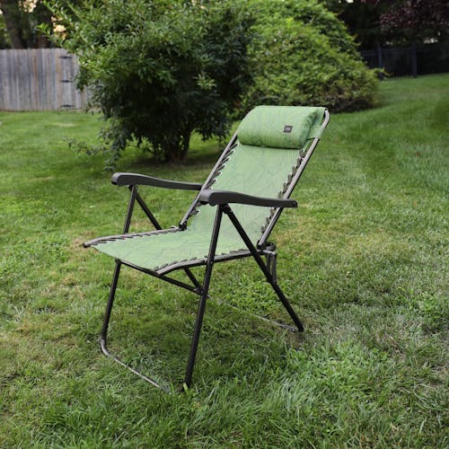 Angled view of a reclined 26-inch Green Banana Leaves Reclining Sling Chair on a lawn.
