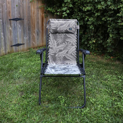 Front view of the 26-inch Platinum Fern Reclining Sling Chair on a lawn.