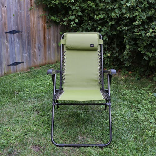 Front view of the 26-inch Sage Green Reclining Sling Chair on a lawn.