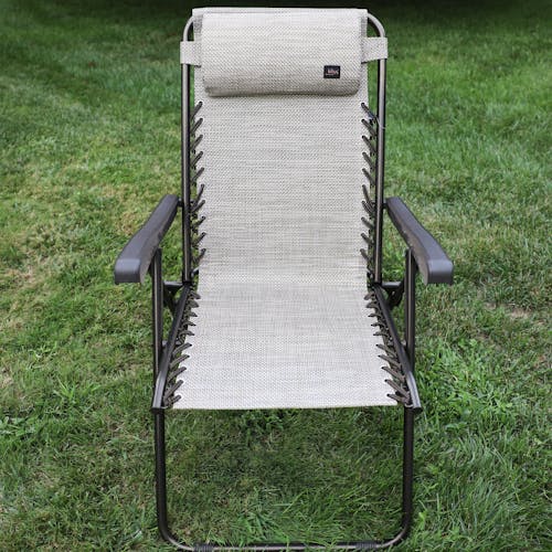 Front view of the 26-inch Sand Reclining Sling Chair on a lawn.