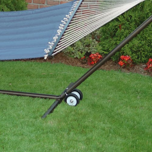 Wheel kit attached to a hammock stand on grass.