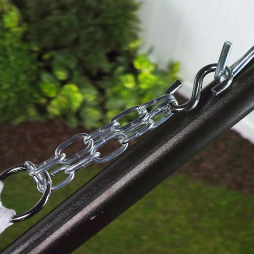 Metal S-hook connected to a stand and a chain holding a hammock.